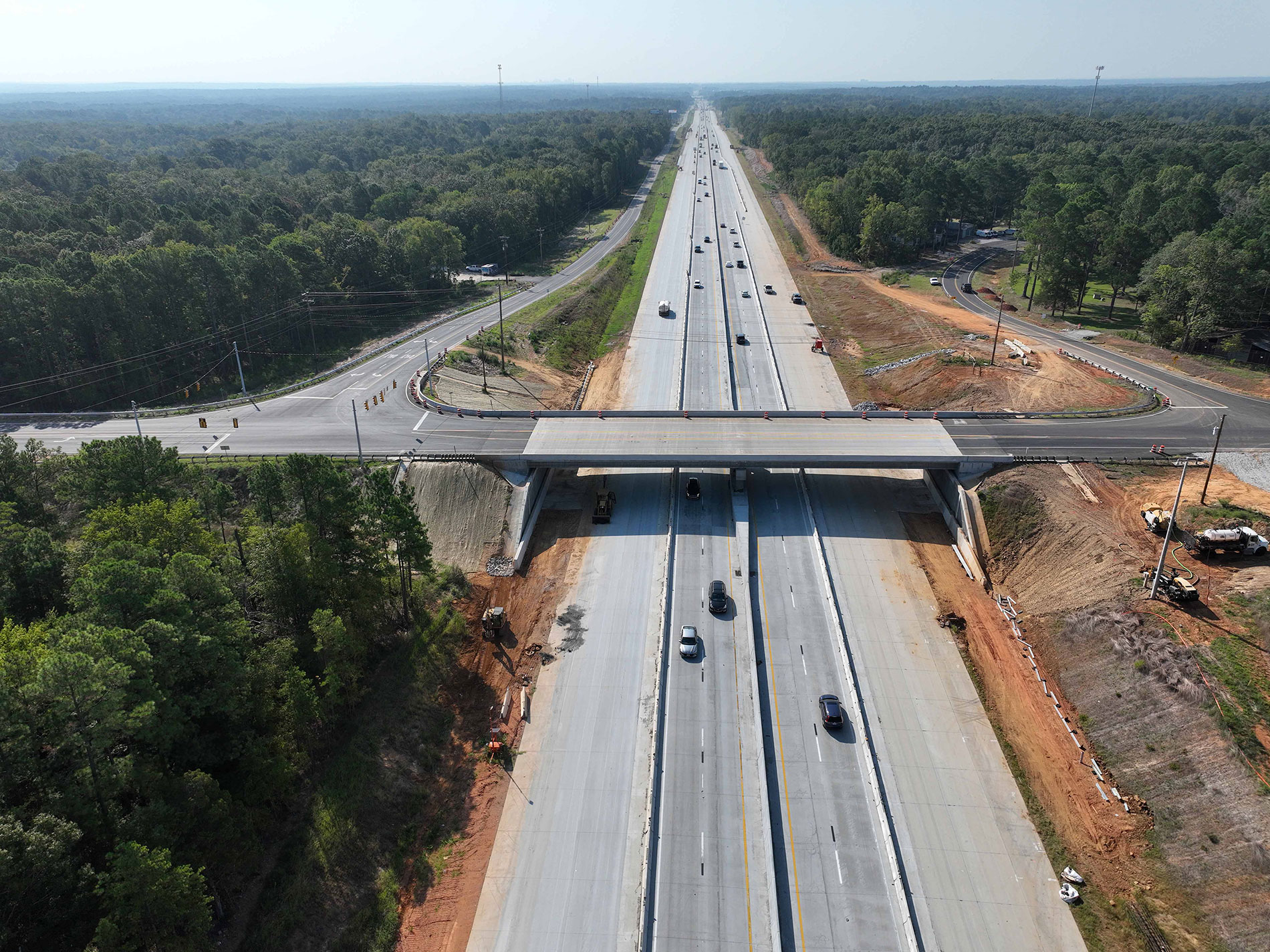 This photo shows the recently opened overpass at Koon Road and the widening of I-26 from 4 to 8 lanes. Traffic is currently located on the two inside lanes, but eventually will have four lanes in each direction from Exit 97 to 101.
