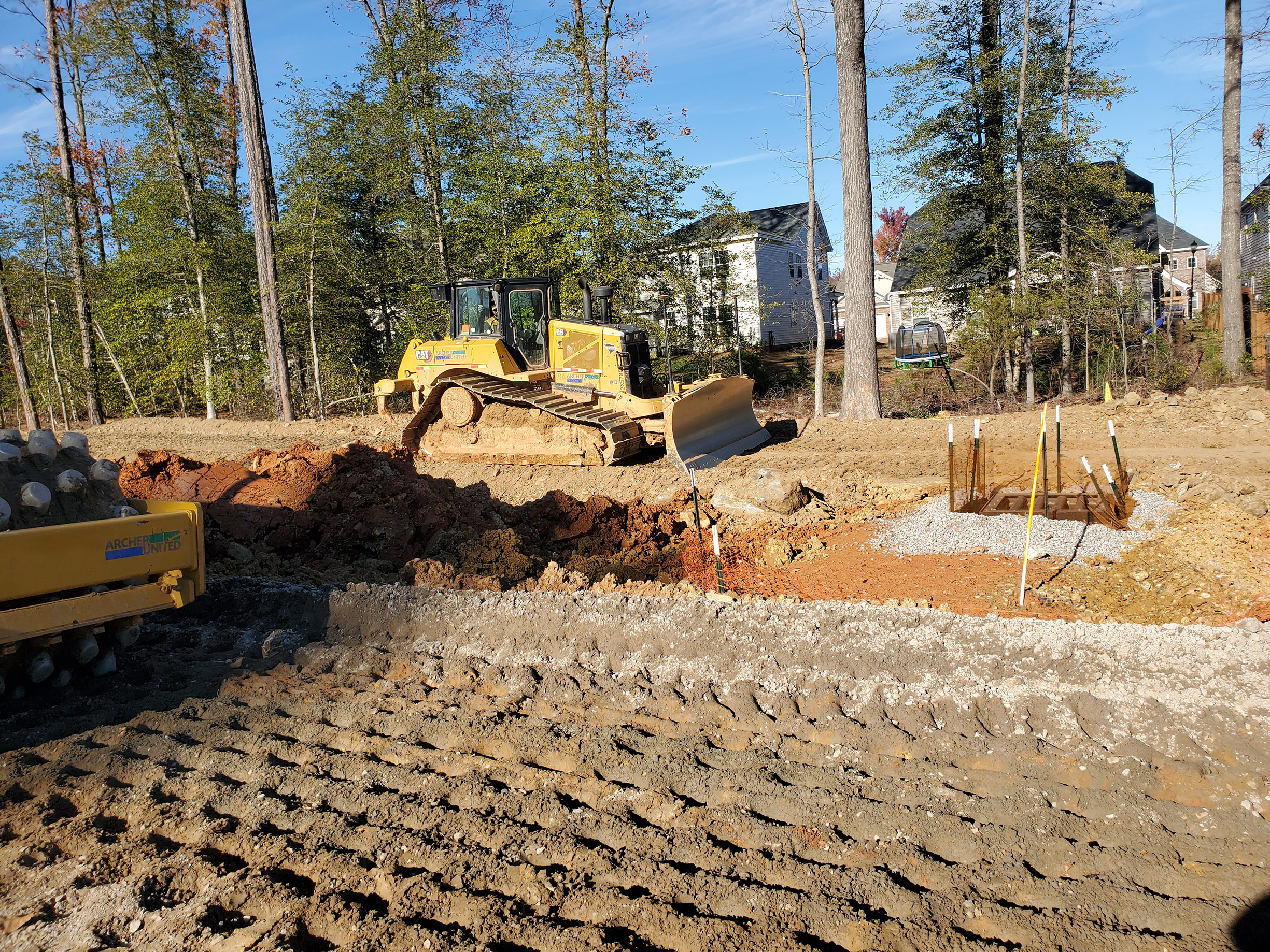 This photo shows the earthwork crews grading and compacting the soils in Segment 2. When earthwork is completed in this area, the sound barrier wall can be erected to reduce the highway noise.